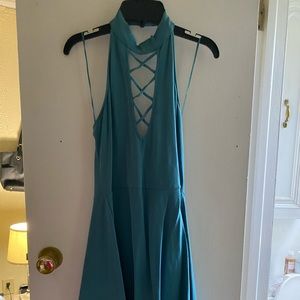 Backless teal dress.